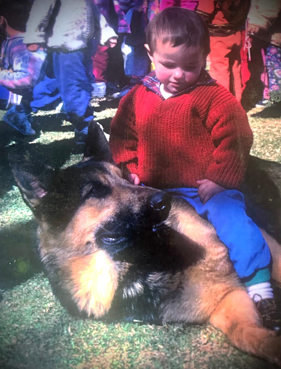 Our Olderhill GSD with a little boy sitting on him